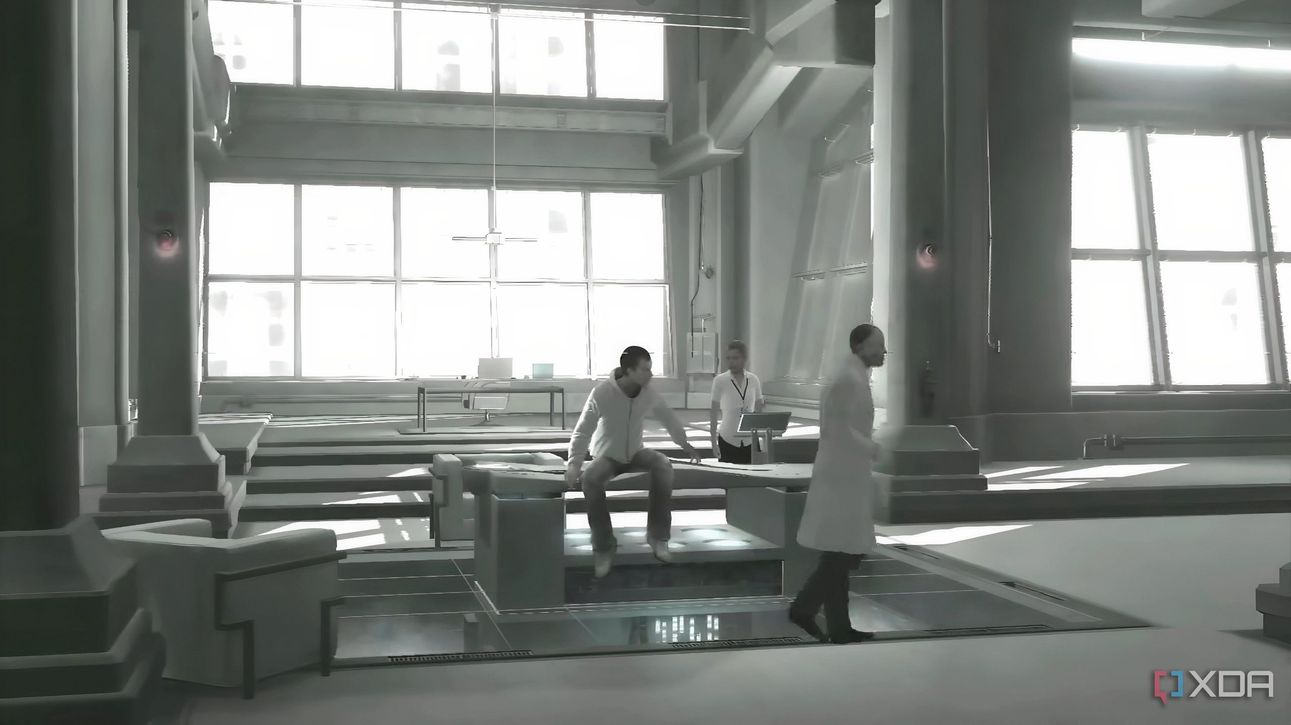 An image from the game Assassins' Creed 1, showing Desmond Miles captive at Abstergo Industries with Warren Vidic.