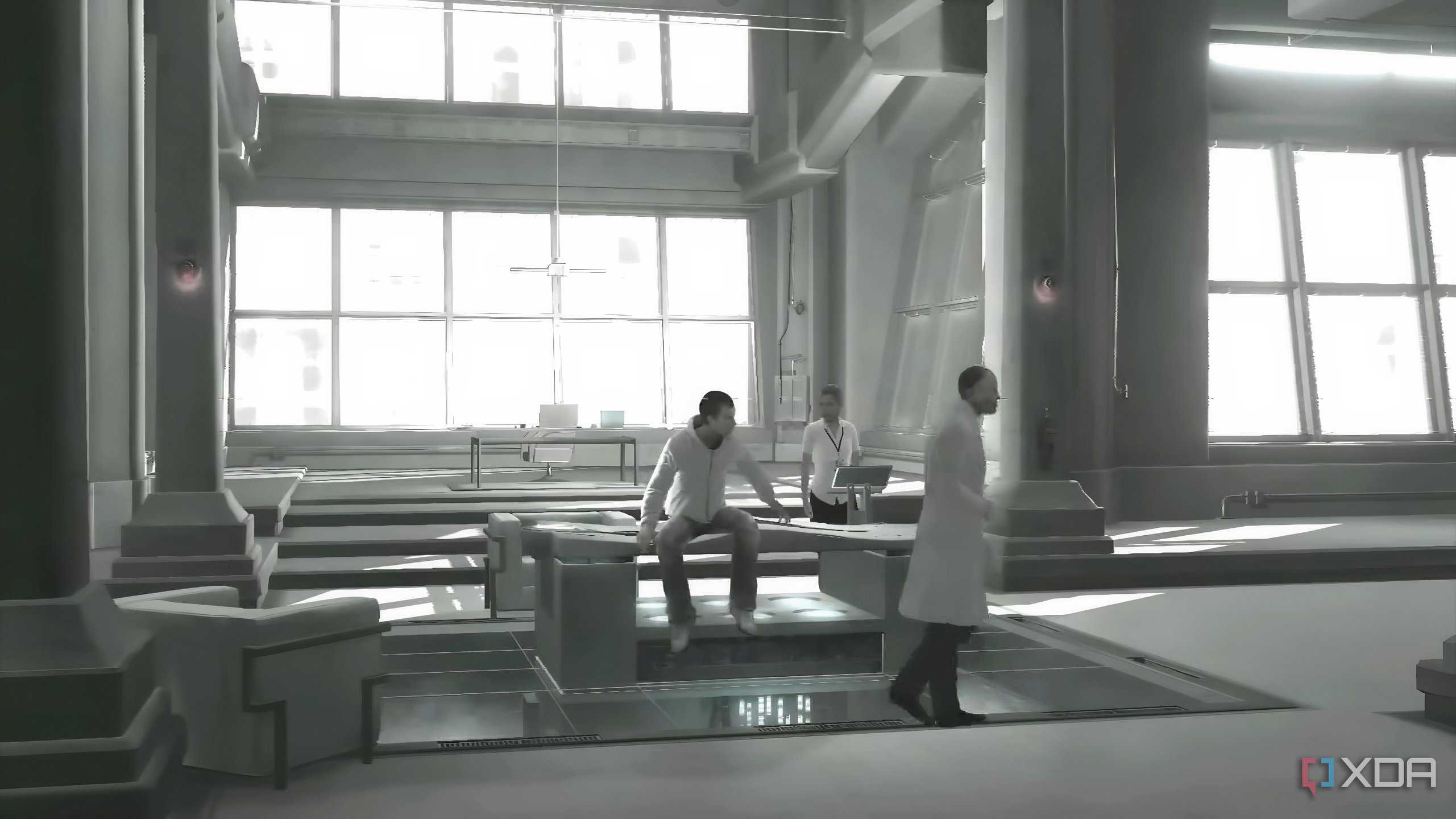 An image from the game Assassins' Creed 1, showing Desmond Miles captive at Abstergo Industries with Warren Vidic.