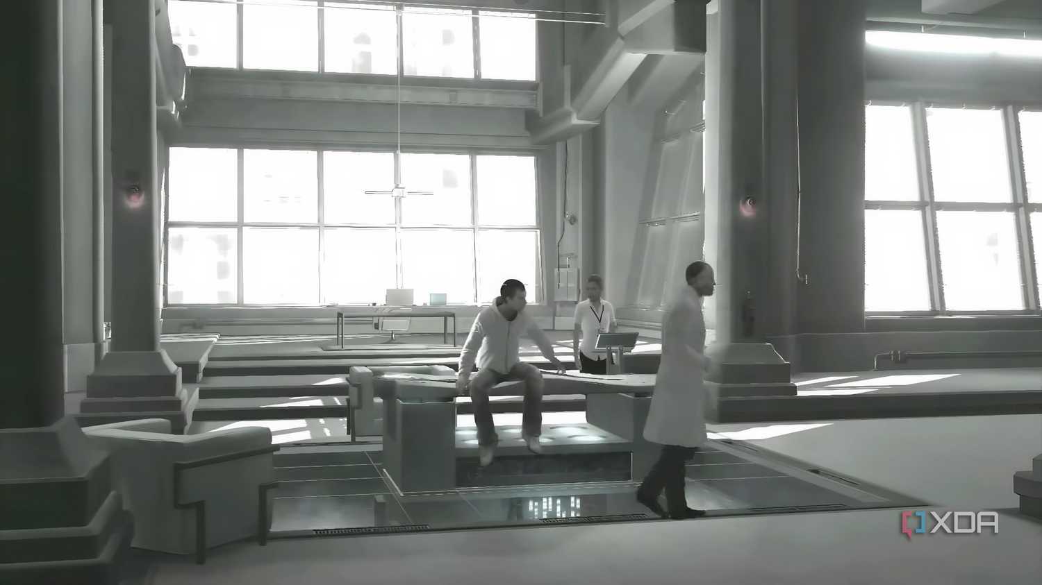 An image from the game Assassins' Creed 1, showing Desmond Miles captive at Abstergo Industries with Warren Vidic.