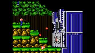A screenshot from the game "Contra", showing the player character fighting against the first stage's boss.