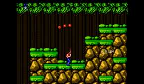 A screenshot from the game "Contra", showing the pler character shooting three bullets into the air above.