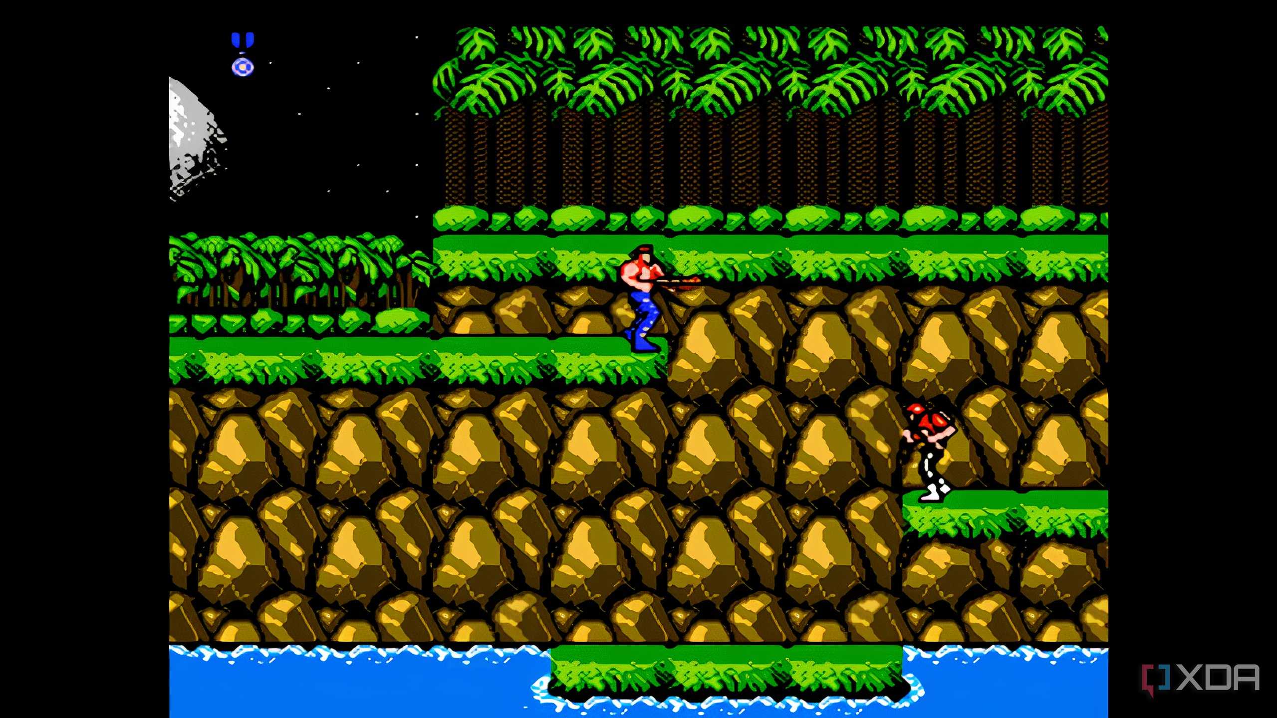 A screenshot from the game "Contra", showing the player character standing in the game's first stage of a forest.