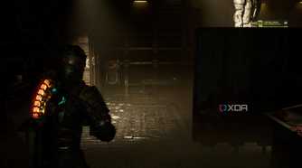 An image from 2023's Dead Space, showing the player character walking in a dark room.