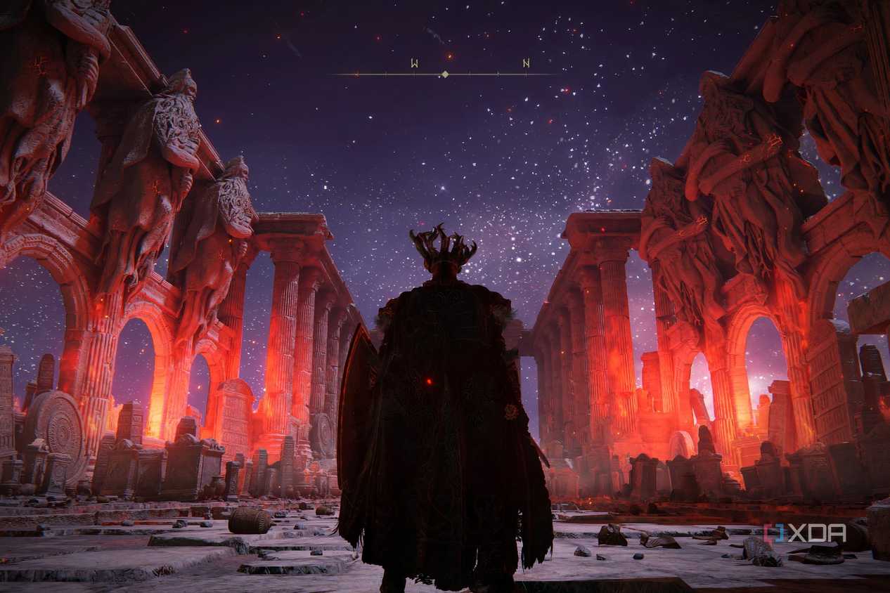 An image from Elden Ring, showing the player character standing in a blood-red, ruined hall.