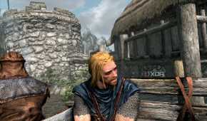 A screenshot from the game "The Elder Scrolls V: Skyrim", showing Ralof, a blonde man.