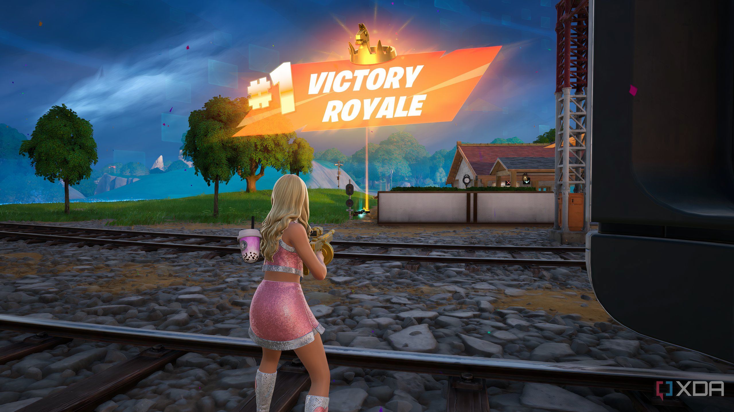 An image from the game Fortnite, showing a pink-clad Sabrina Carpenter winning a match.