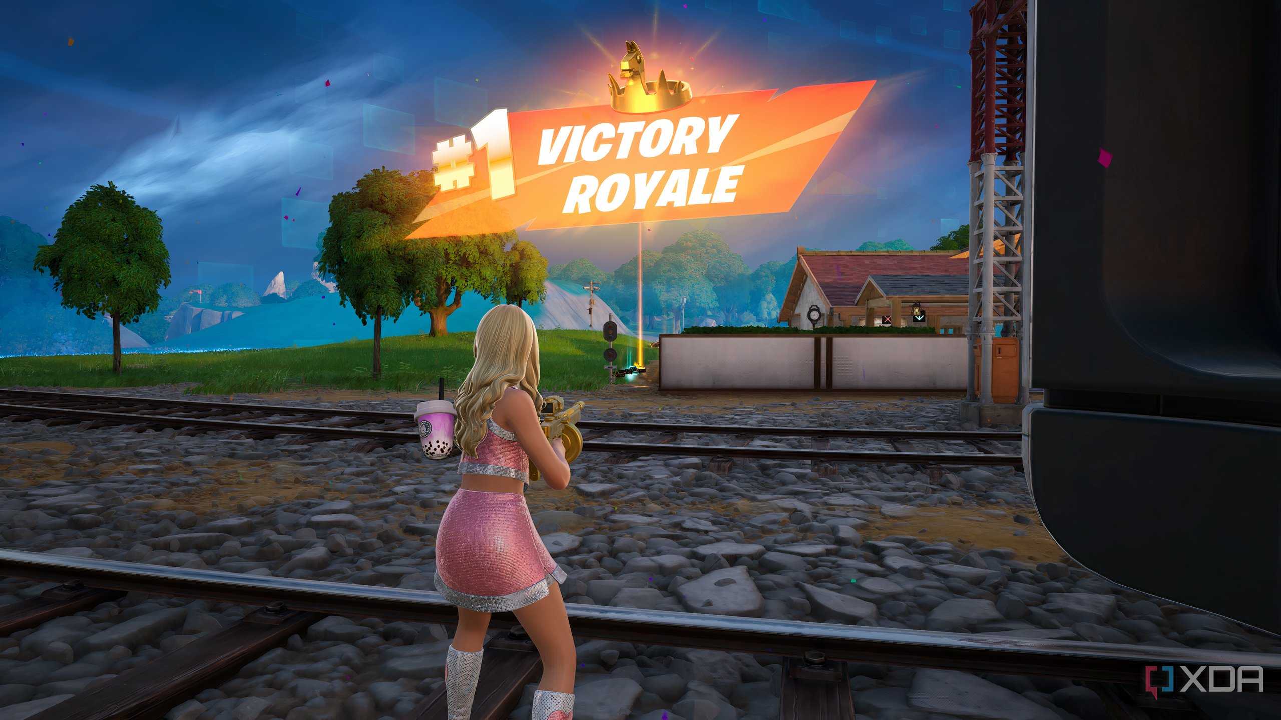 An image from the game Fortnite, showing a pink-clad Sabrina Carpenter winning a match.