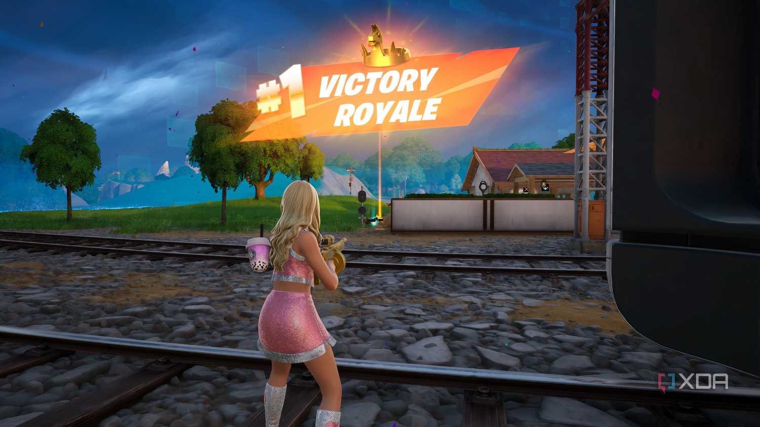 An image from the game Fortnite, showing a pink-clad Sabrina Carpenter winning a match.