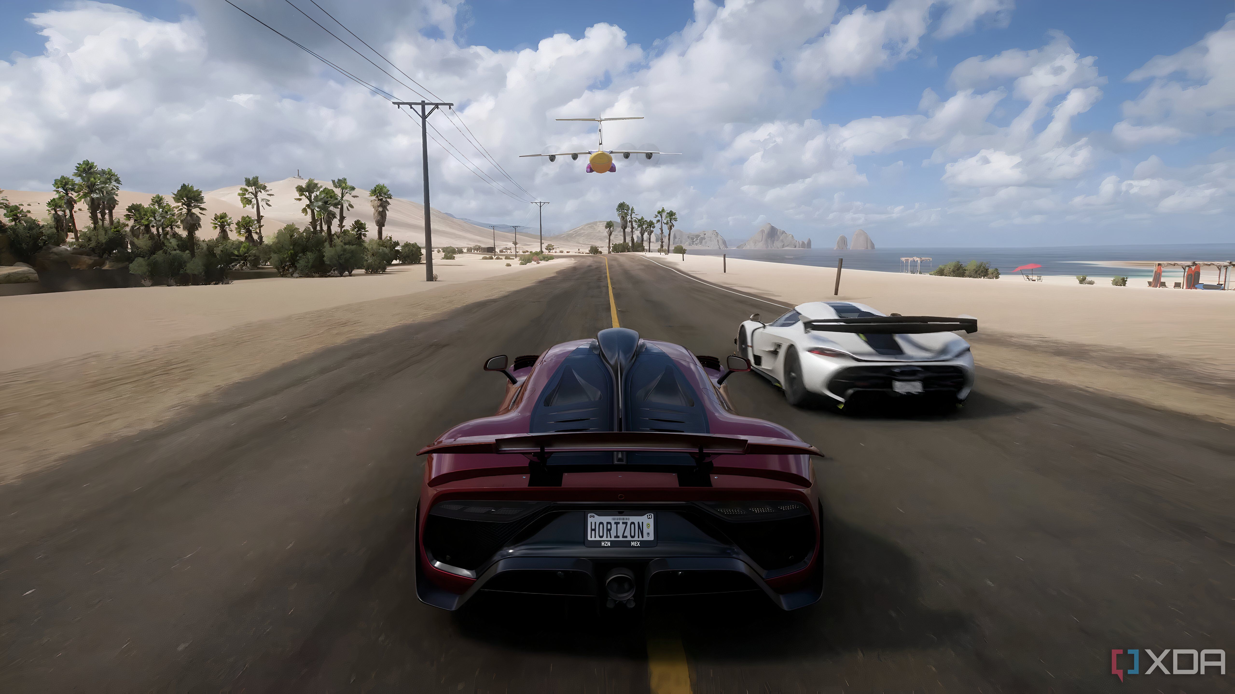 The opening of Forza Horizon 5, showing a red Mercedes AMG-ONE racing along a beach.