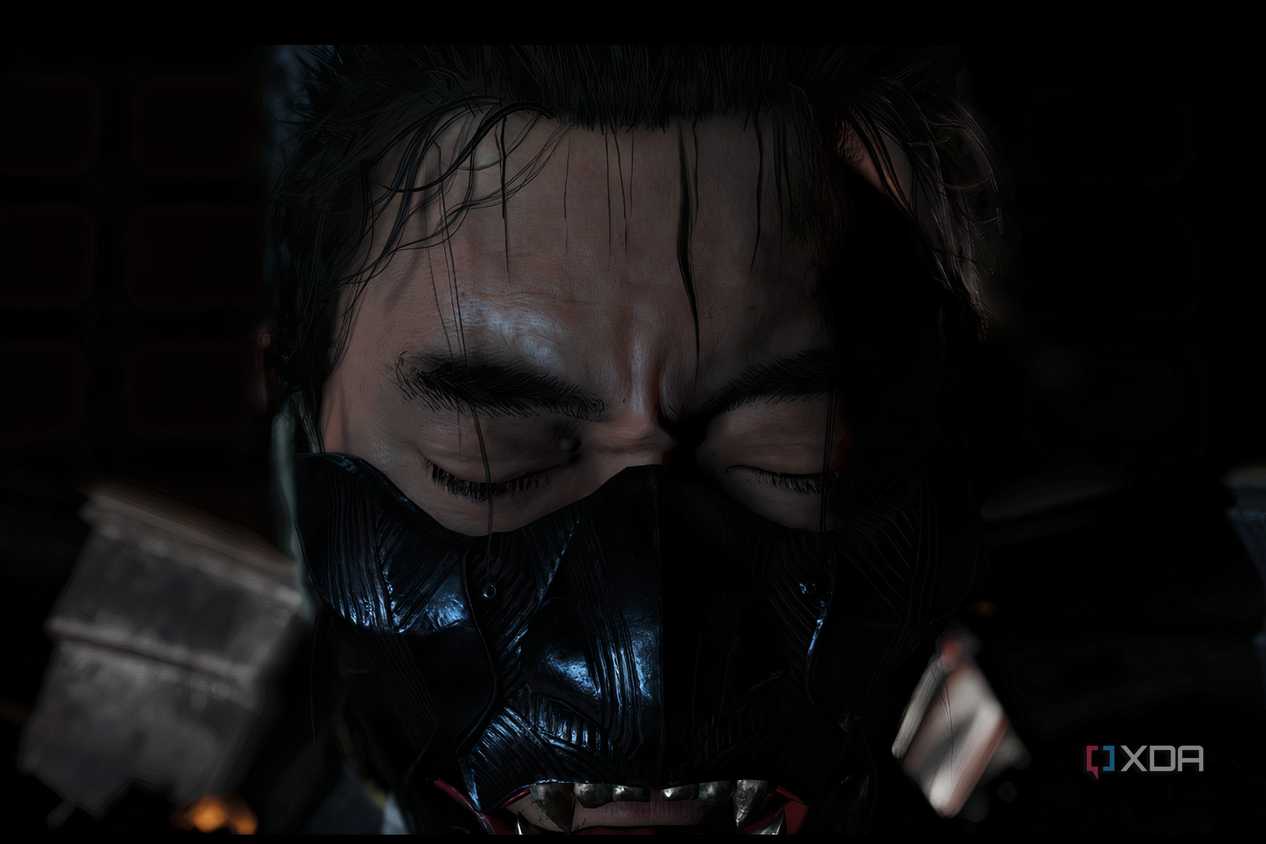 A screenshot from Ghost of Tsushima, showing Jin looking emotional as he wears the mask of the ghost.