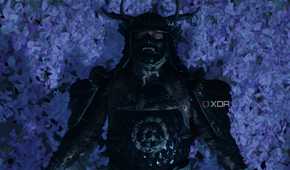 A screenshot from Ghost of Tsushima, showing Jin Sakai wearing Sakai armor and laying down on a bed of lilac petals.