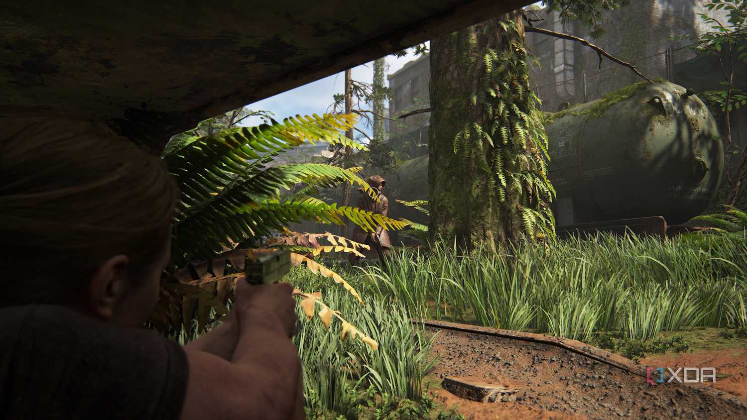 A screenshot from the game The Last of Us Part II, showing Abby aiming at an enemy.