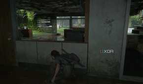 A screenshot from the game The Last of Us Part II, showing Ellie crouching in cover.