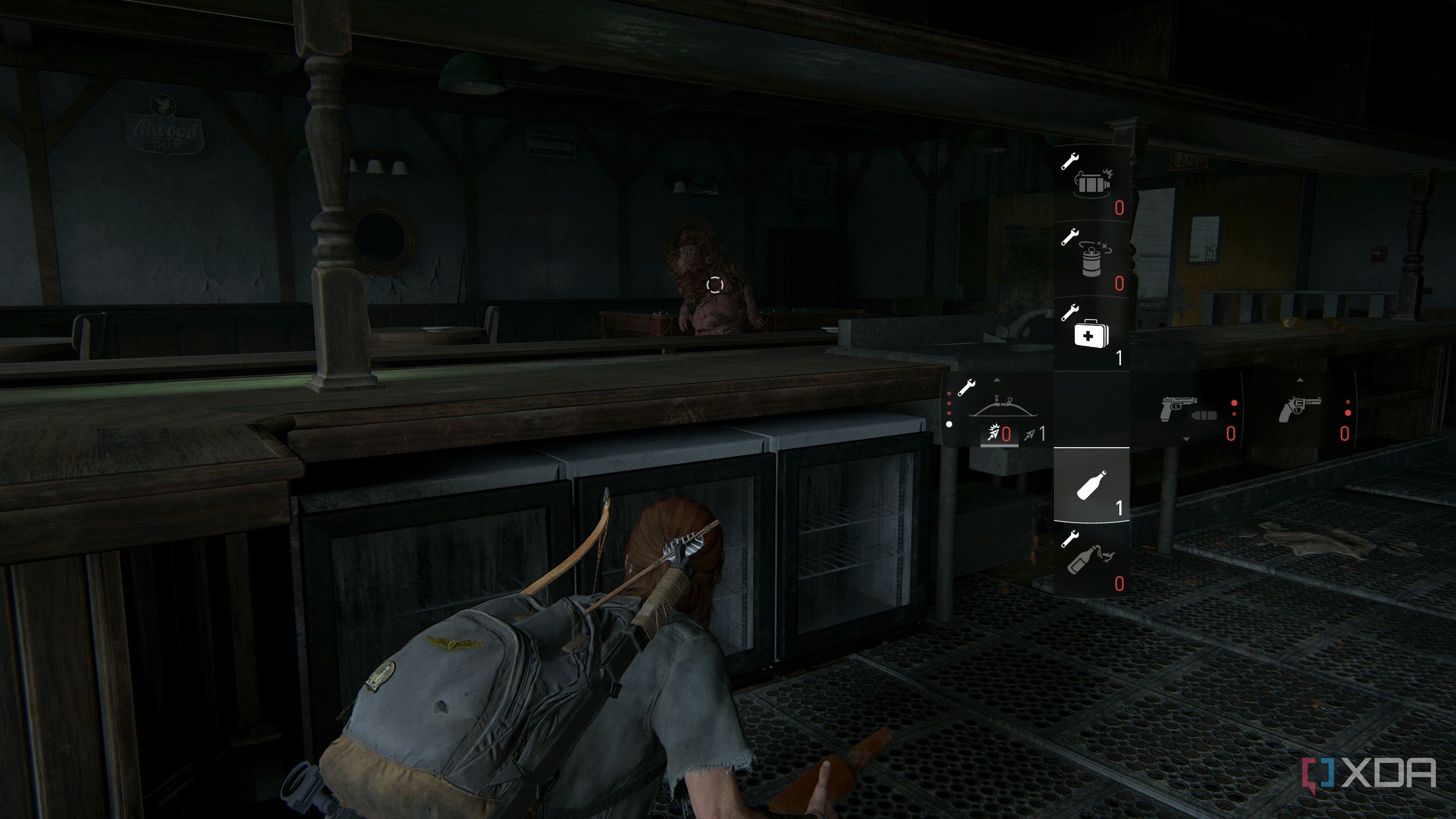 A screenshot from the game The Last of Us Part II, showing Ellie crouching in cover with her inventory almost empty.