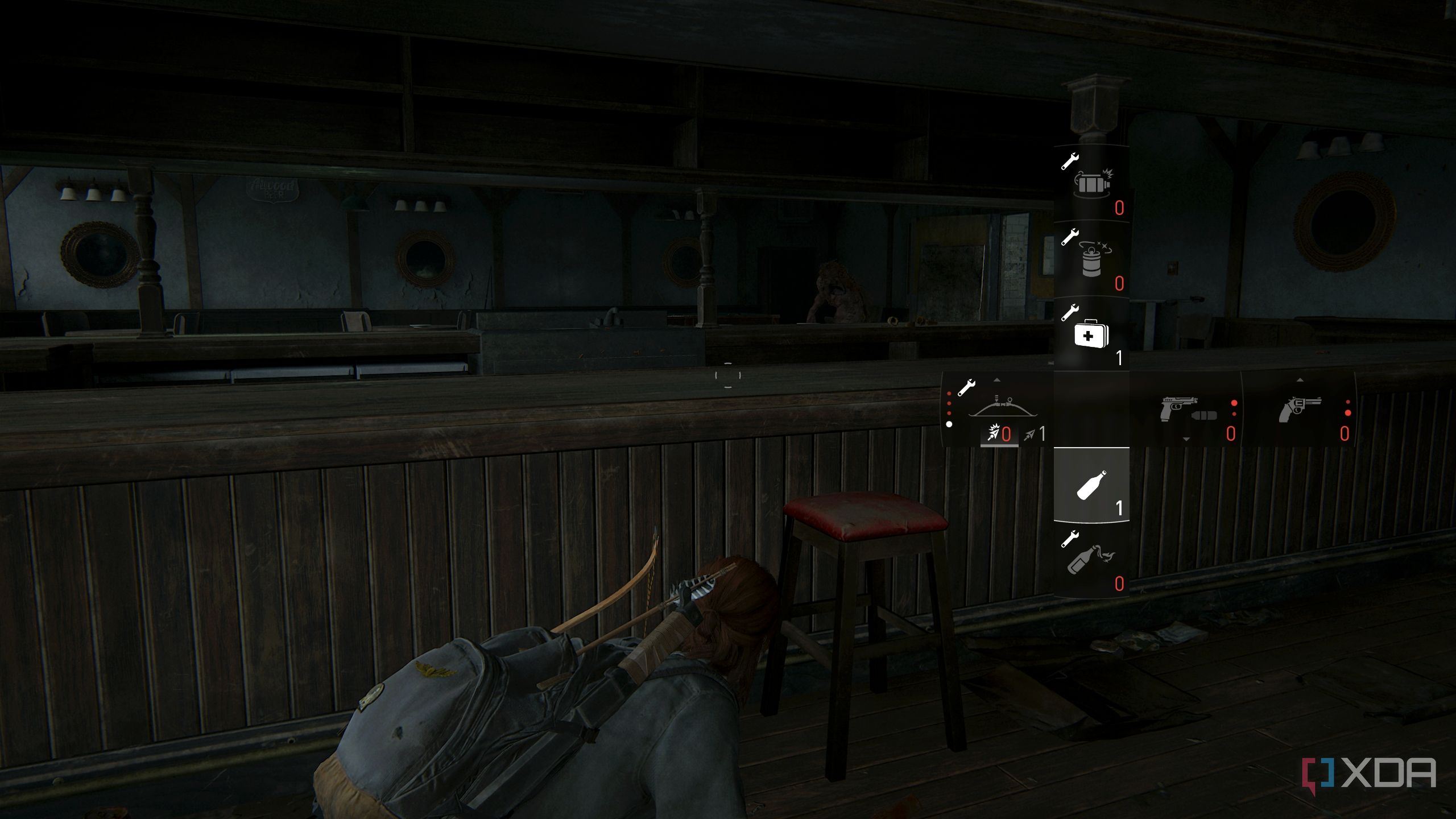 A screenshot from the game The Last of Us Part II, showing Ellie crouching in cover while her inventory runs low.
