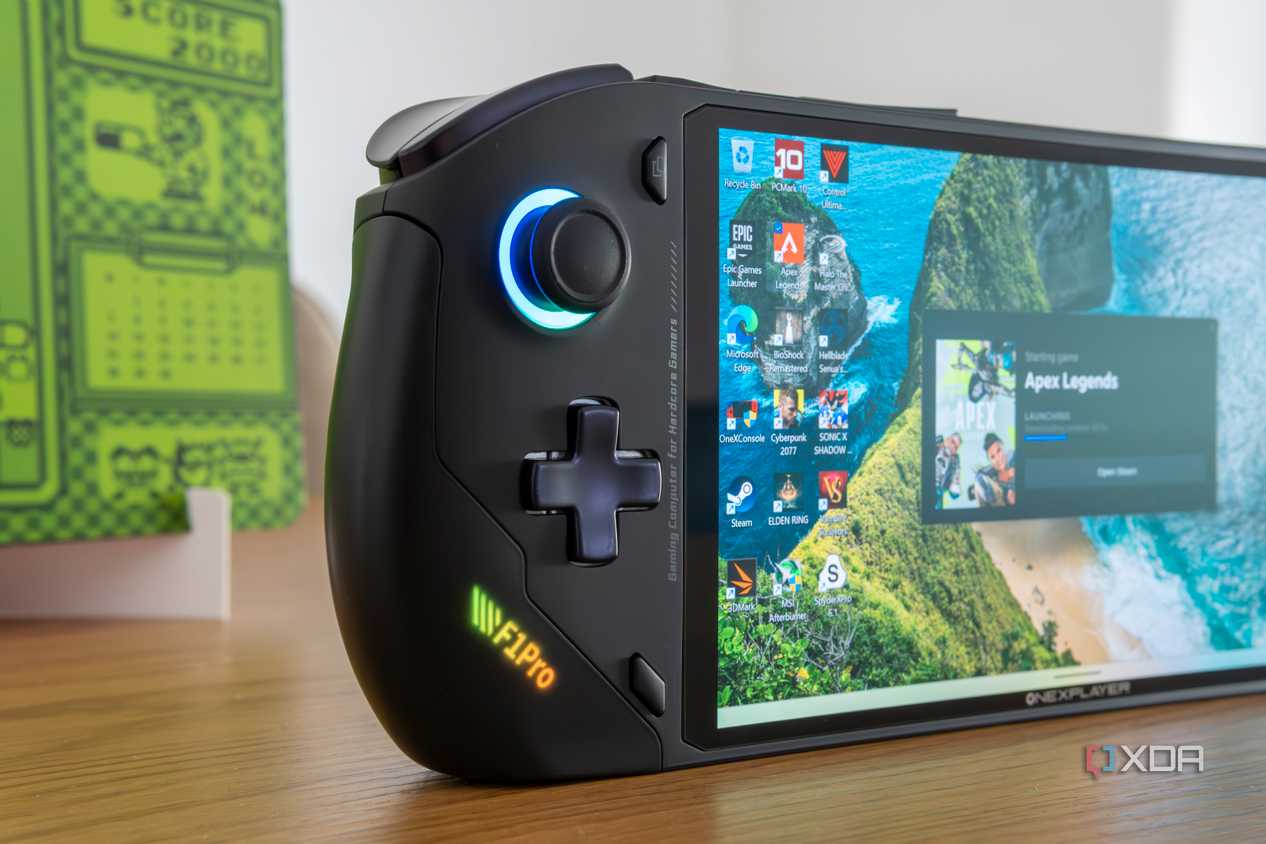 Close-up view of the OneXFly F1 Pro showing the left hand controls and the screen displaying the Windows 11 desktop