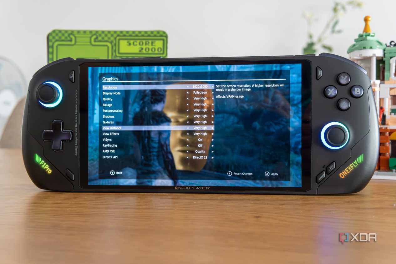 Angled front view of the OneXFly F1 Pro showing graphics settings for Hellblade Senua's Sacrifice