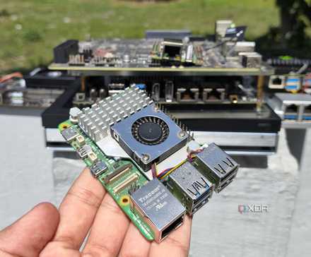 Your Old Chromebook: An Unexpected Home Server Solution 8 A person holding a Raspberry Pi in front of other SBCs, mini-PCs, and NAS