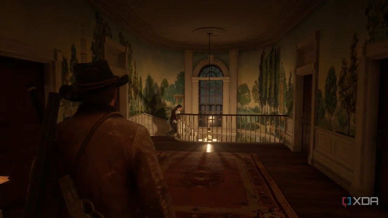An image from the game Red Dead Redemption 2, showing Arthur Morgan walking down a dimly-lit hallway.