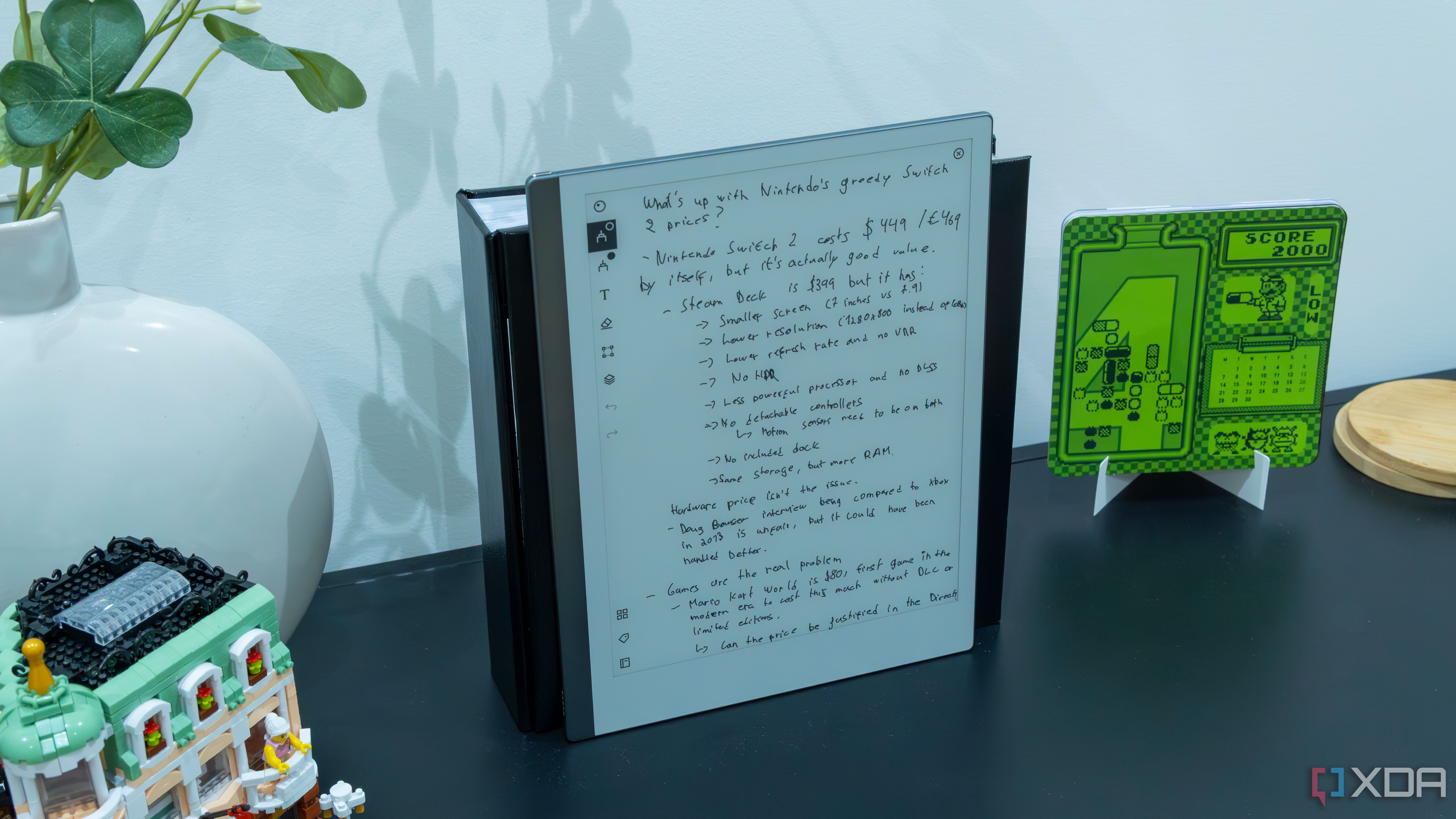 A ReMarkable 2 displaying handwritten notes standing up on a piece of furniture surrounded by decor