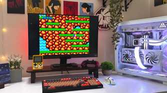 An image of a gaming PC on a desk with the 1987 game Contra running on the monitor screen.