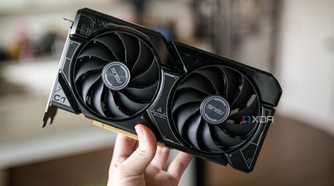 A hand holding the Nvidia RTX 4060 GPU.