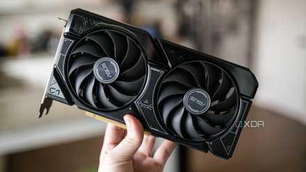 Hand holding Nvidia RTX 4060 GPU.