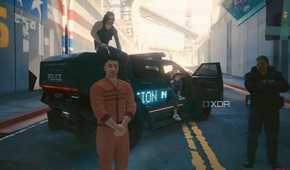 A screenshot from Cyberpunk 2077, showing a man in an orange jumpsuit, and another man sitting atop a police vehicle.