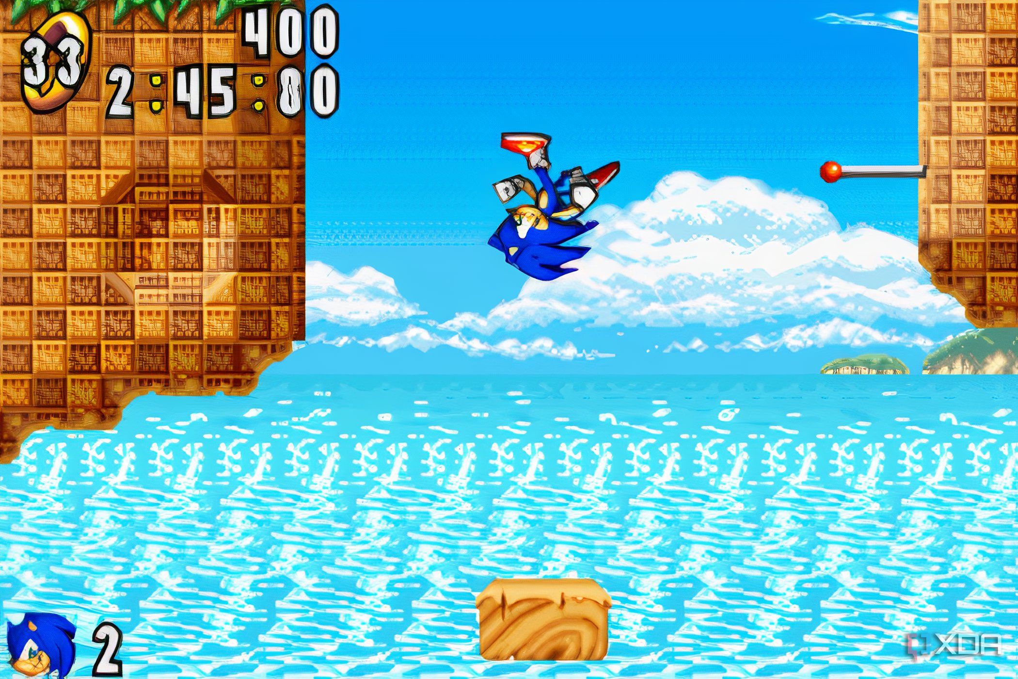 A screenshot from the game "Sonic Advance", showing Sonic bouncing off a brown rock and somersaulting in mid-air.
