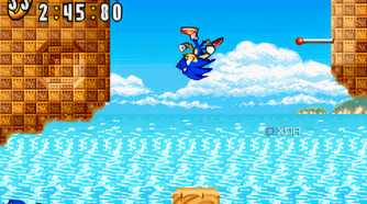 A screenshot from the game "Sonic Advance", showing Sonic bouncing off a brown rock and somersaulting in mid-air.