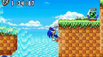 A screenshot from the game "Sonic Advance", showing Sonic grabbing onto a pole jutting out of a cliff wall.
