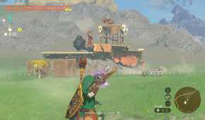 Link aiming a muddle bud at a battle talus who is still laying in the earth.