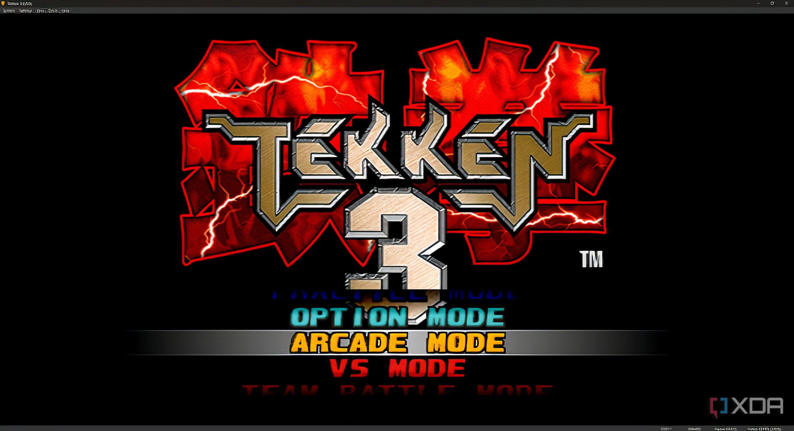 A screenshot from the game "Tekken 3", showing the game's main menu and splash screen.