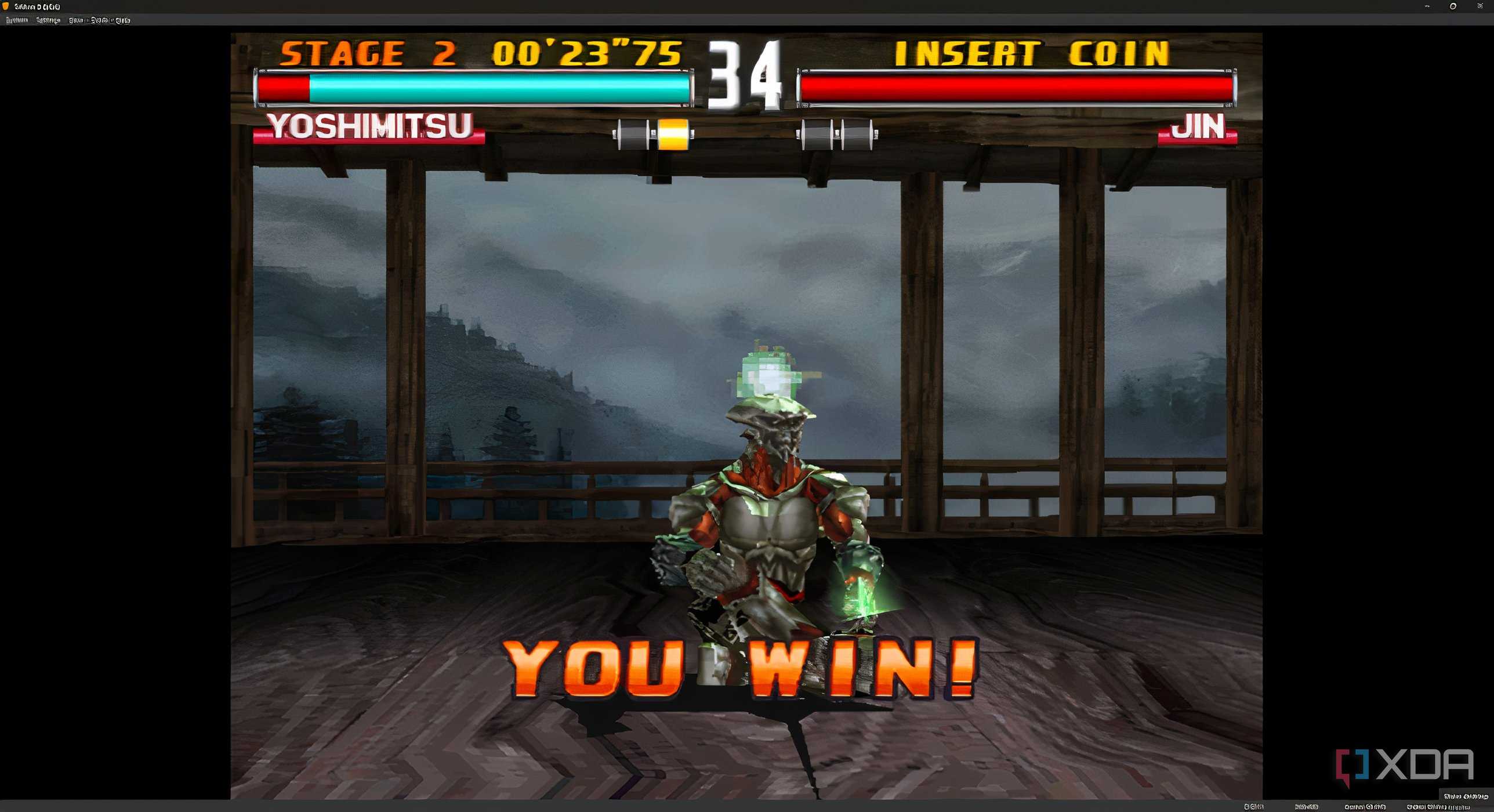 A screenshot from the game "Tekken 3", showing Yoshimitsu sitting cross-legged after a victory.