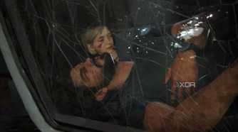 A screenshot from The Last of Us Part I on PC, showing Joel unconscious in a car through a cracked windshield, while his daughter Sarah is behind him, coming to.