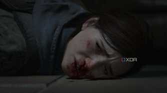 A screenshot from the game The Last of Us Part II Remastered on PC, showing Ellie's face bloodied.