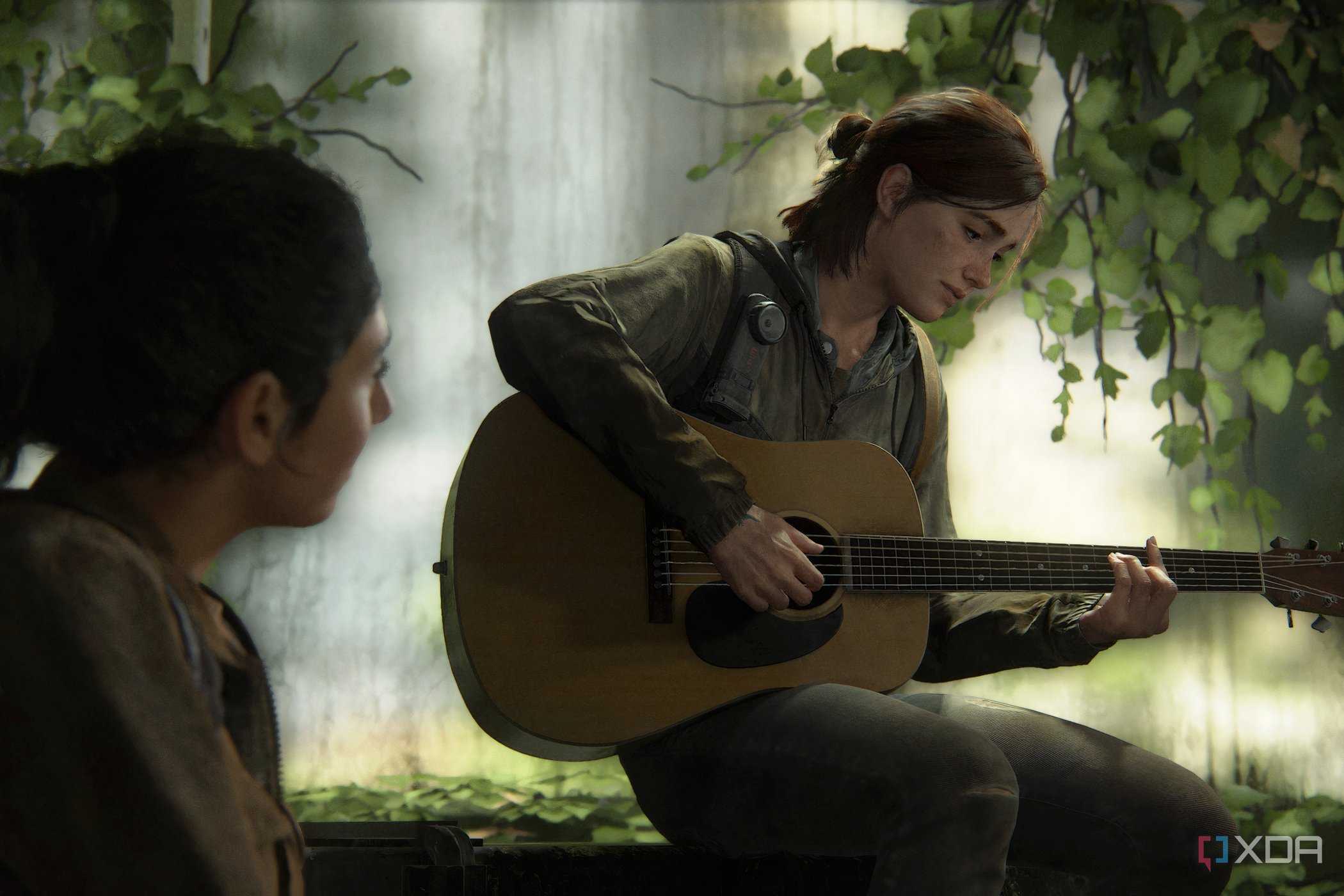 A screenshot from The Last of Us Part II, showing Ellie playing a guitar.