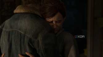 A screenshot from the game The Last of Us Part II Remastered on PC, showing Ellie hugging Tommy.