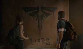 A screenshot from the game The Last of Us Part II Remastered on PC, showing Joel and Ellie looking at the Fireflies logo painted on a wall.