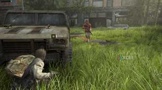 A screenshot from the game The Last of Us Part II Remastered on PC, showing Bill crouching in front of a jeep as an enemy patrols nearby.
