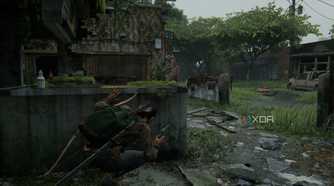 A screenshot from the game The Last of Us Part II Remastered on PC, showing Dina crouching in cover while an enemy with a bow patrols nearby.