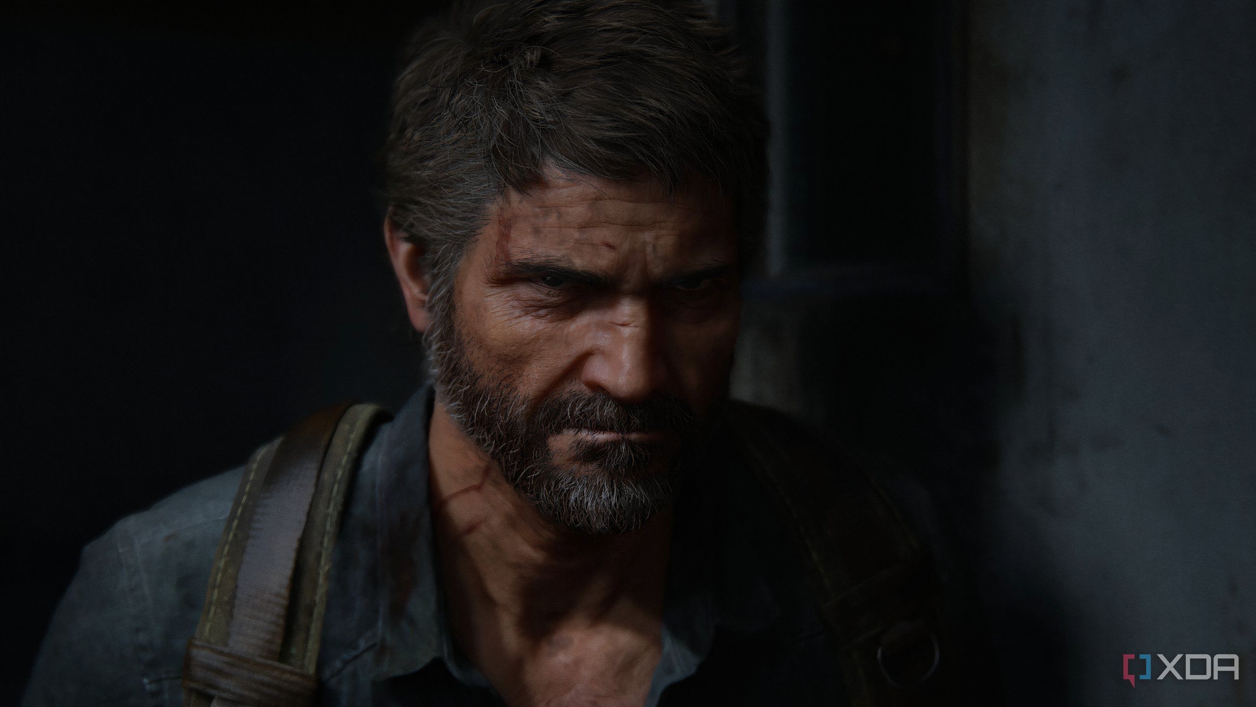 A screenshot from the game The Last of Us Part II Remastered on PC, showing Joel frowning.