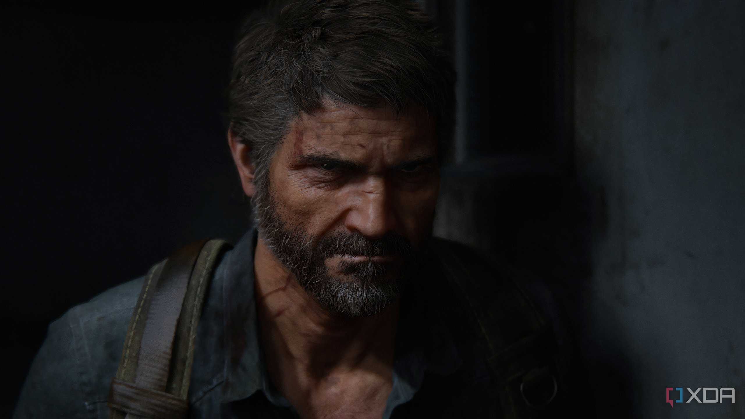 A screenshot from the game The Last of Us Part II Remastered on PC, showing Joel frowning.