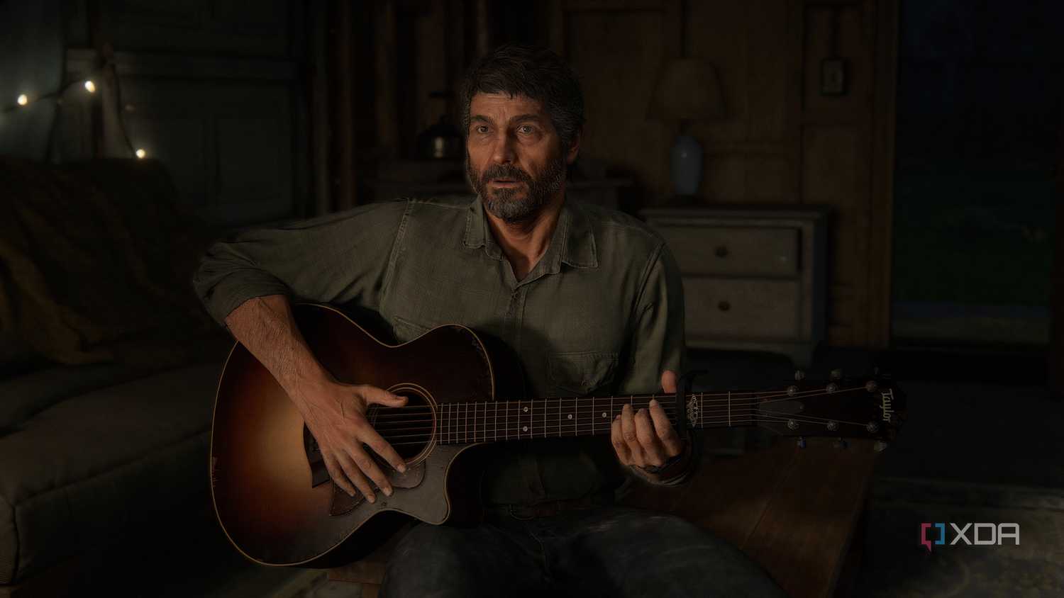 A screenshot from the game The Last of Us Part II Remastered on PC, showing Joel holding a guitar.