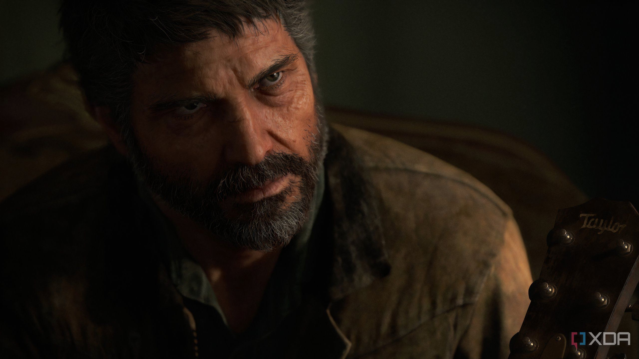 A screenshot from the game The Last of Us Part II Remastered on PC, showing Joel looking serious.