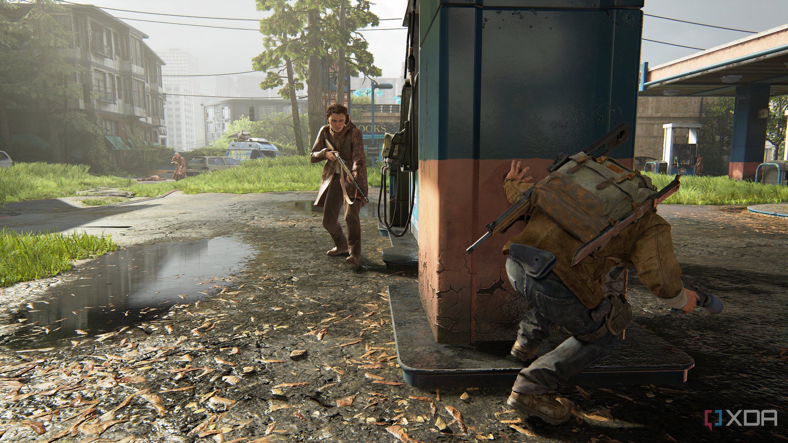 A screenshot from the game The Last of Us Part II Remastered on PC, showing Tommy crouching at a gas station.