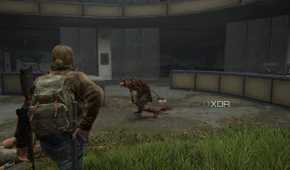 A screenshot from the game The Last of Us Part II Remastered on PC, showing Tommy taking out a gun while walking up to a chained clicker zombie.