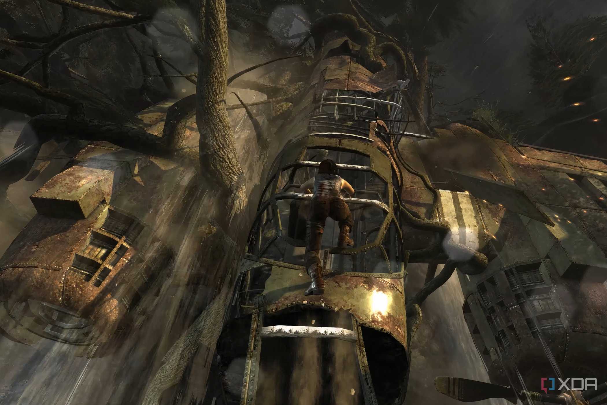 A screenshot from the 2013 game Tomb Raider, showing Lara Croft climb up a dilapidated metal plane.