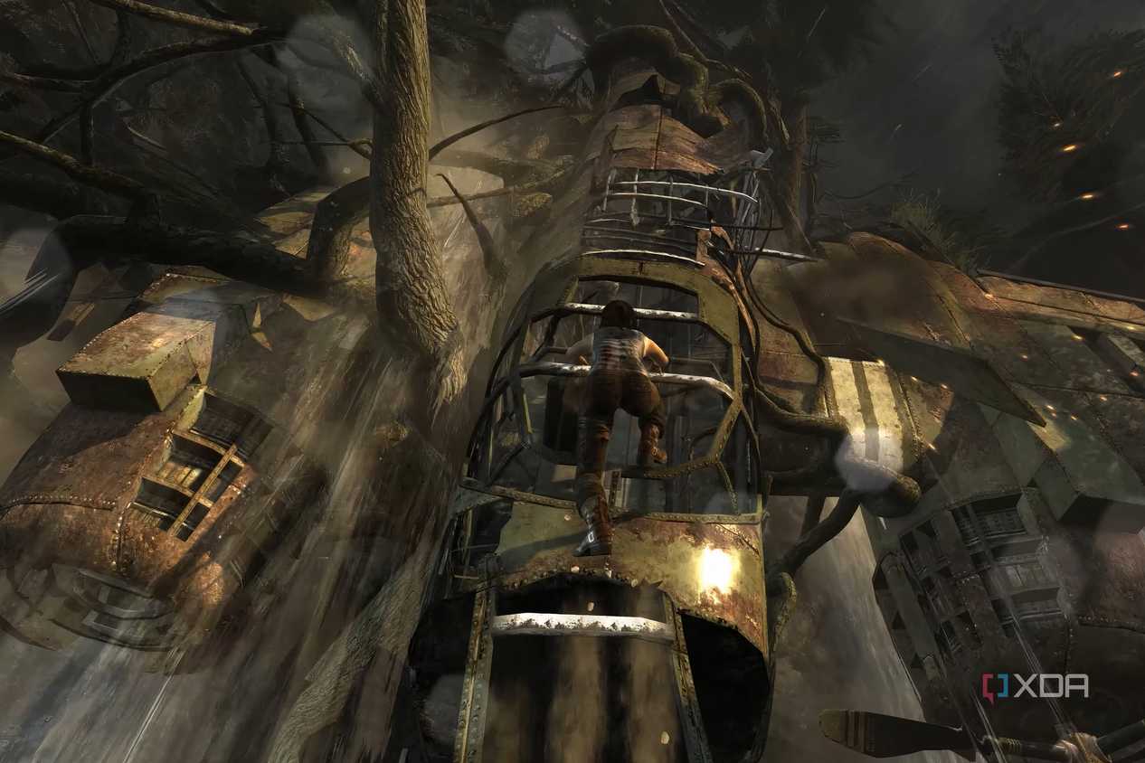 A screenshot from the 2013 game Tomb Raider, showing Lara Croft climb up a dilapidated metal plane.