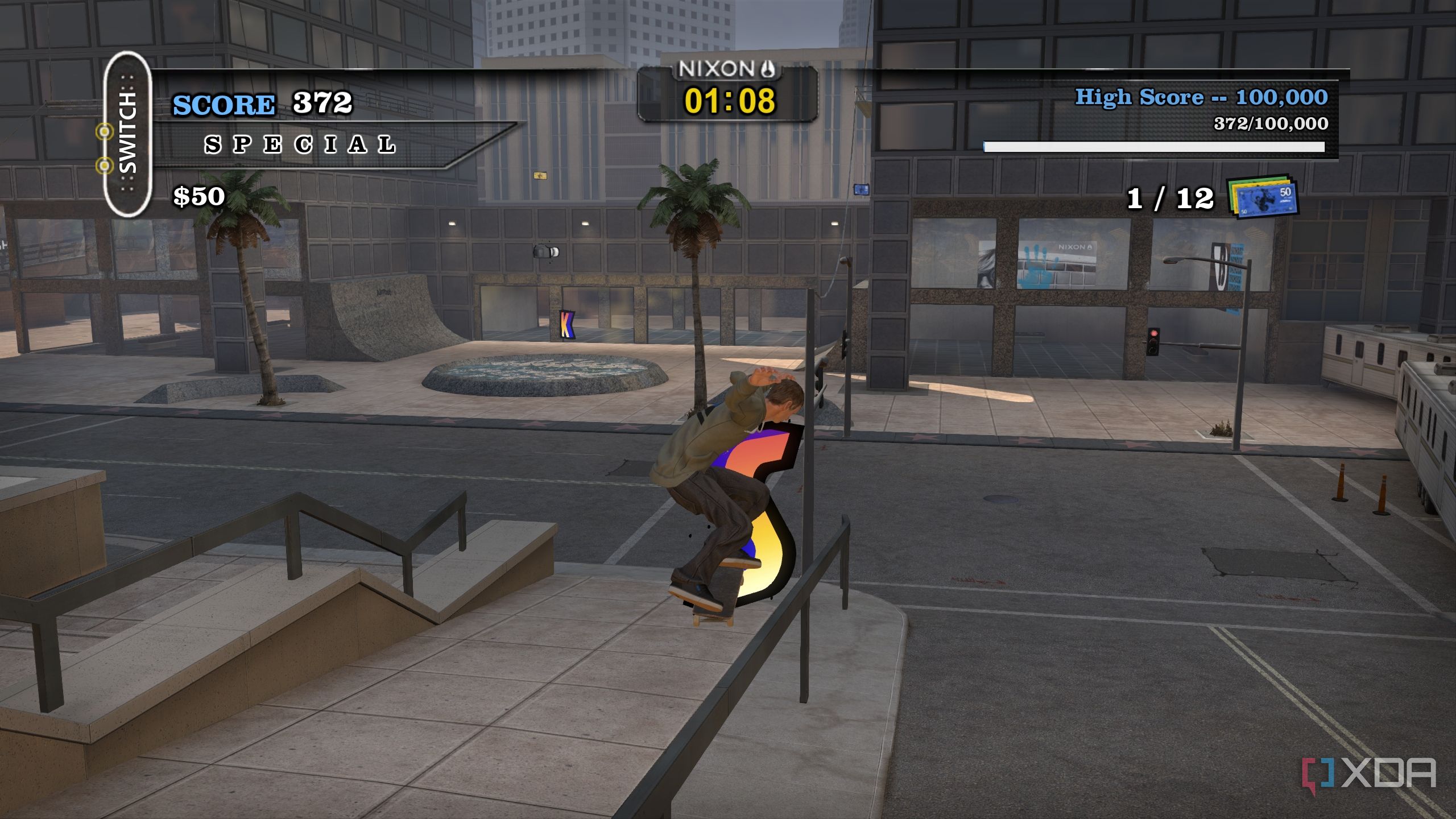 A screenshot from the 2012 game "Tony Hawk's Pro Skater HD", showing Tony Hawk grinding on a rail in the game's Los Angeles map.
